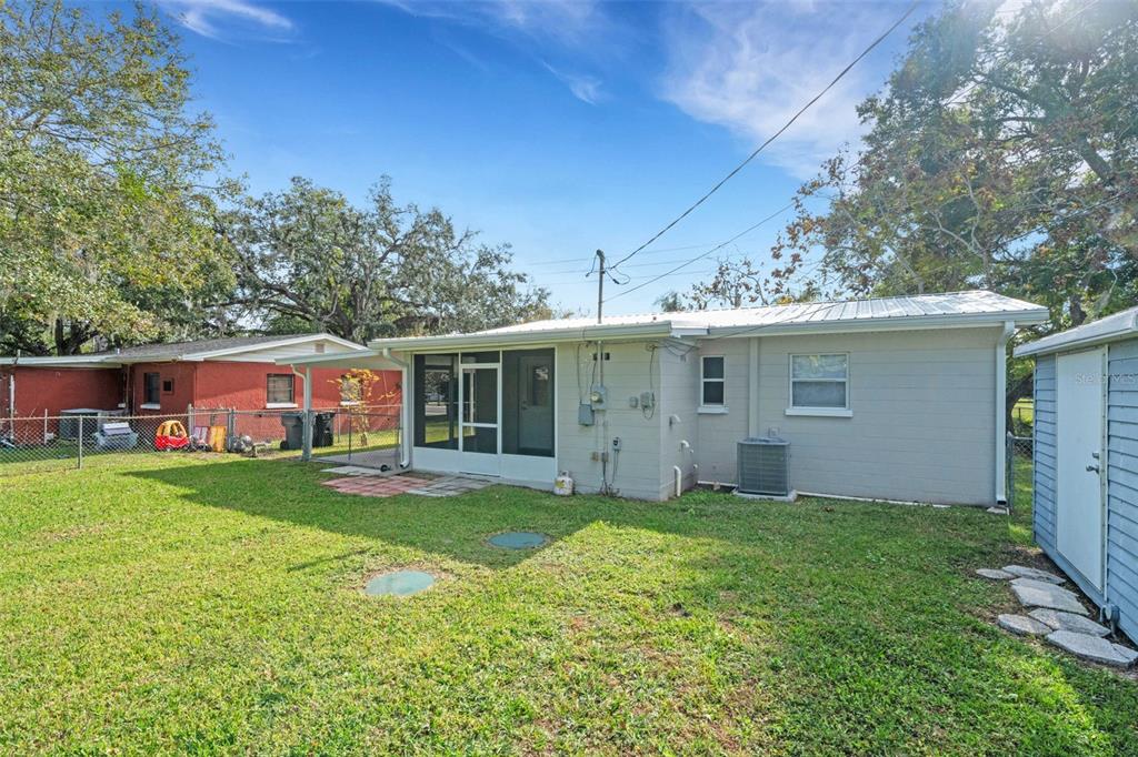 2716 Hardin Combee Road Lakeland, FL 33801 - Photo 29 of 32 a view of a yard with a house and a large tree