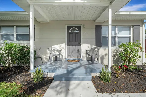 a front view of a house with outdoor space