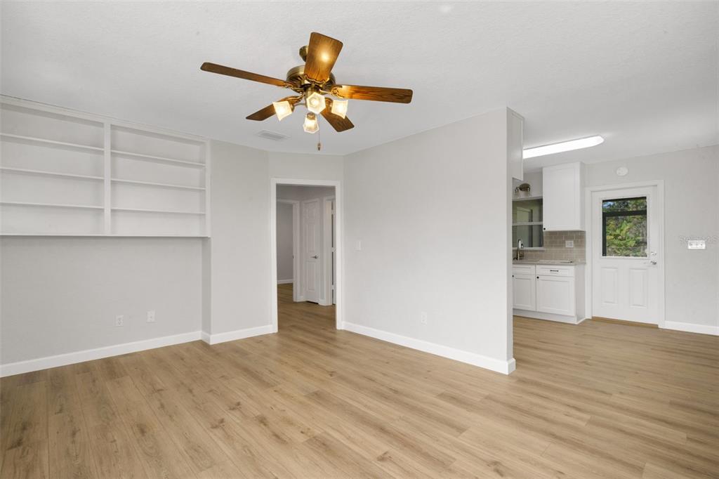 2716 Hardin Combee Road Lakeland, FL 33801 - Photo 10 of 32 a view of an empty room with a window and wooden floor