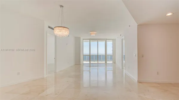 a kitchen with stainless steel appliances granite countertop a refrigerator and a stove