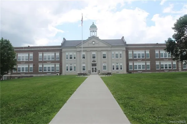 a view of a street with cars