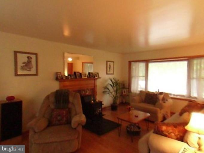 8369 Ball Road Frederick, MD 21704 - Photo 4 of 5 a living room with furniture and a large window