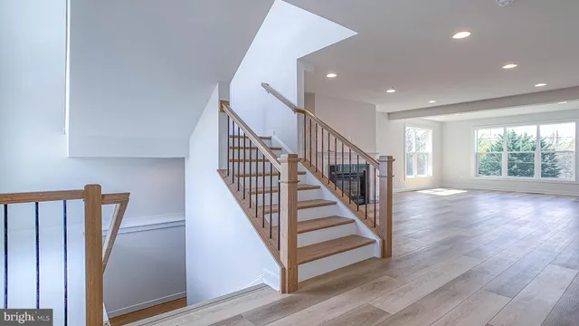 a view of entryway with wooden floor and stairs