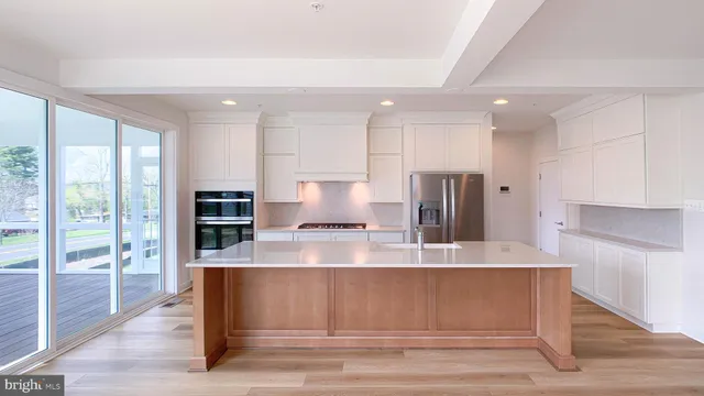 a view of kitchen with wooden floor