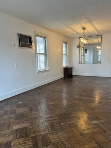 a view of an empty room with glass door