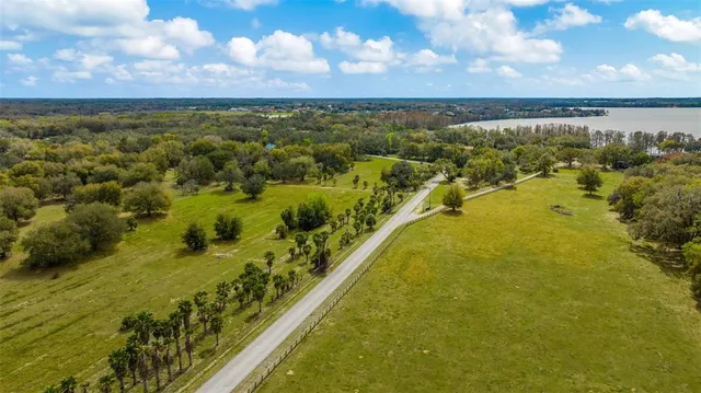 a aerial view of residential houses with yard