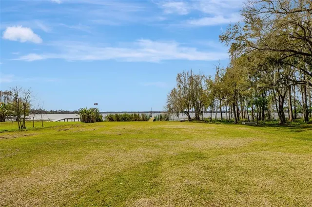a view of a swimming pool and an outdoor seating