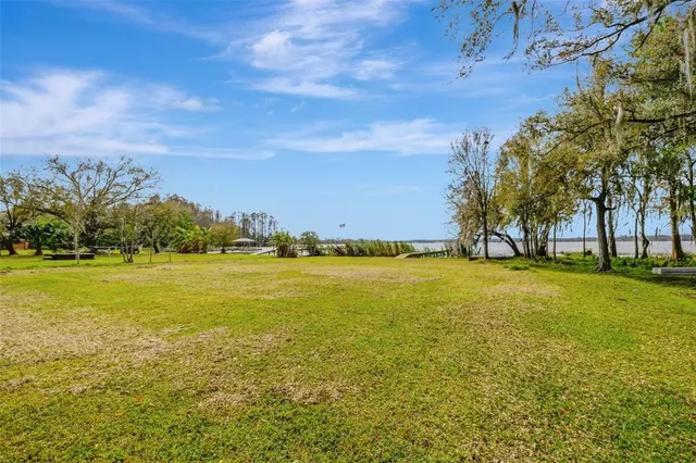 a view of a fountain with tree in the background