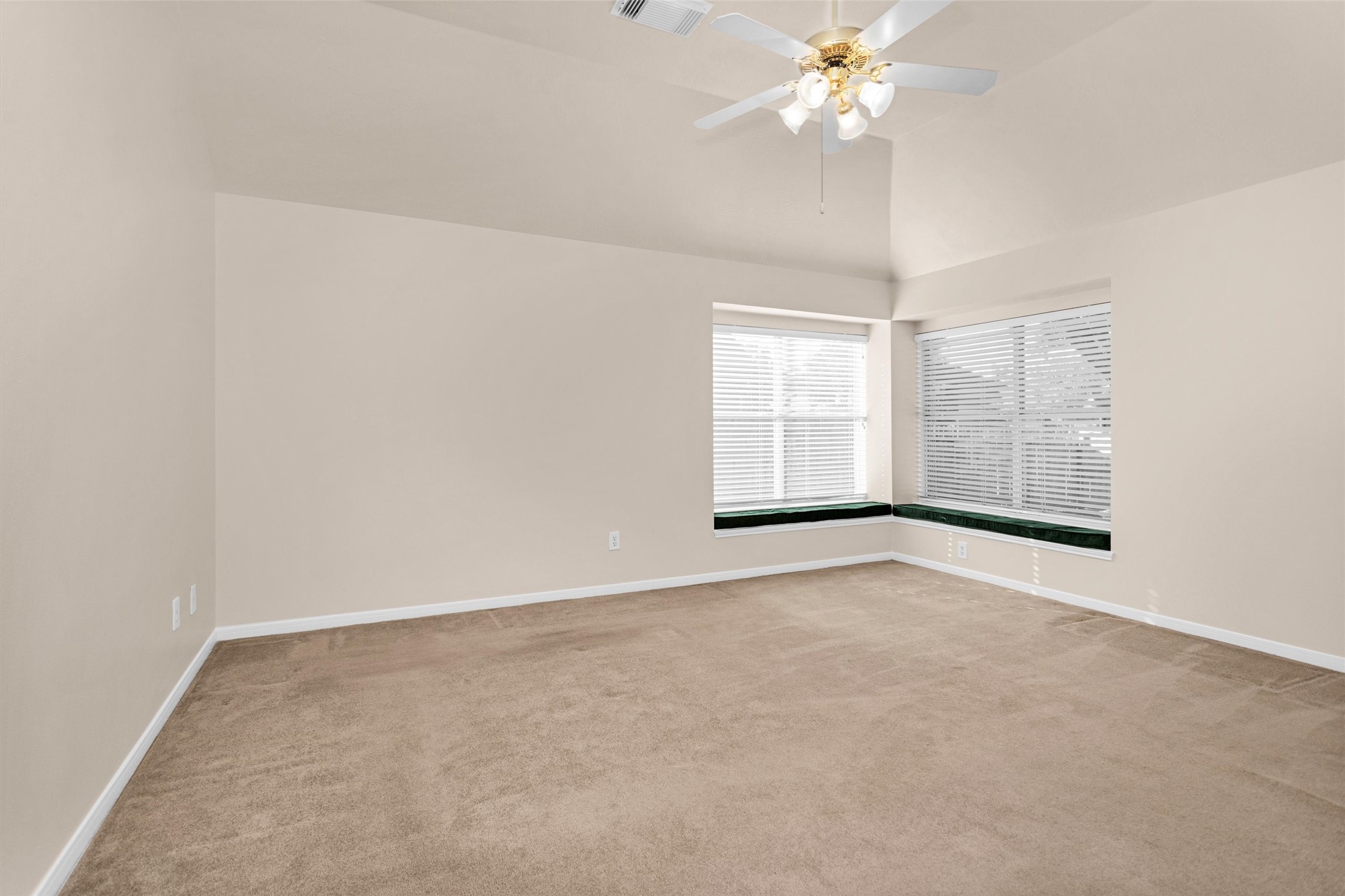 2615 Honeysuckle Walk Spring, TX 77388 - Photo 20 of 39 an empty room with windows and chandelier fan