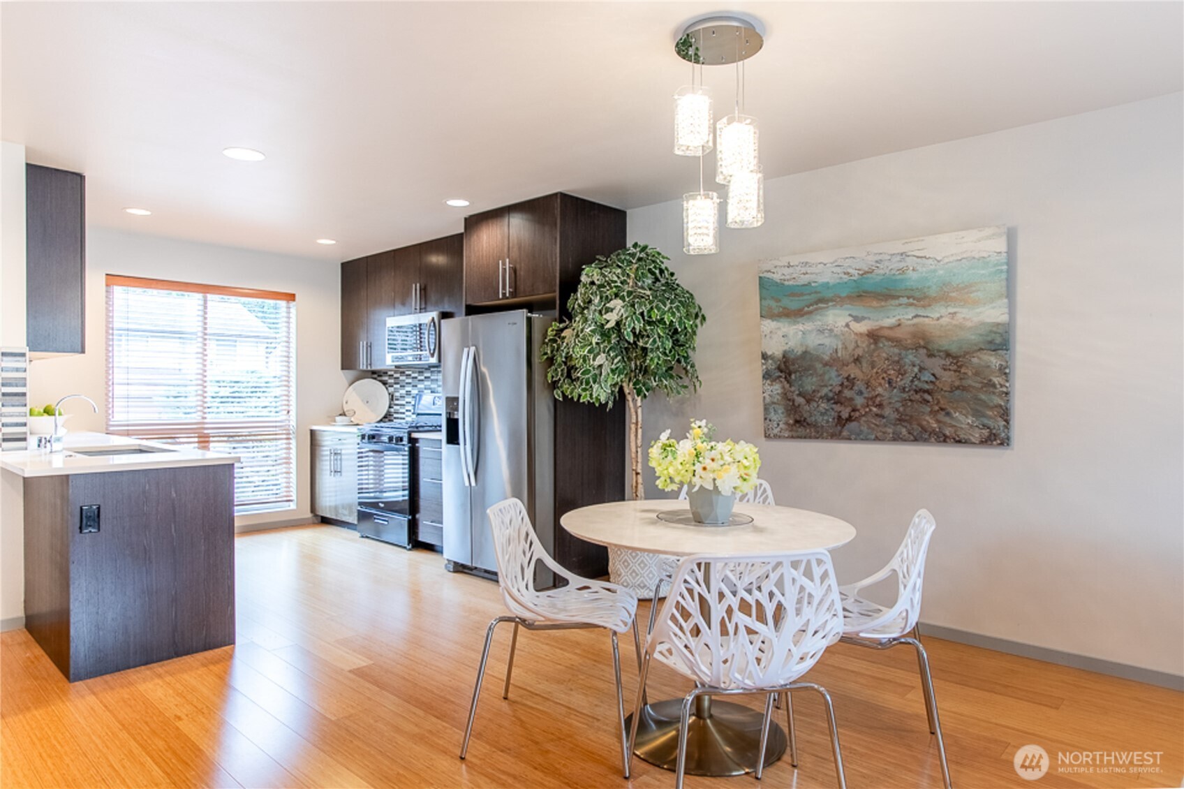 1465 South Columbian Way Seattle, WA 98144 - Photo 15 of 35 a dining room with furniture a chandelier and wooden floor