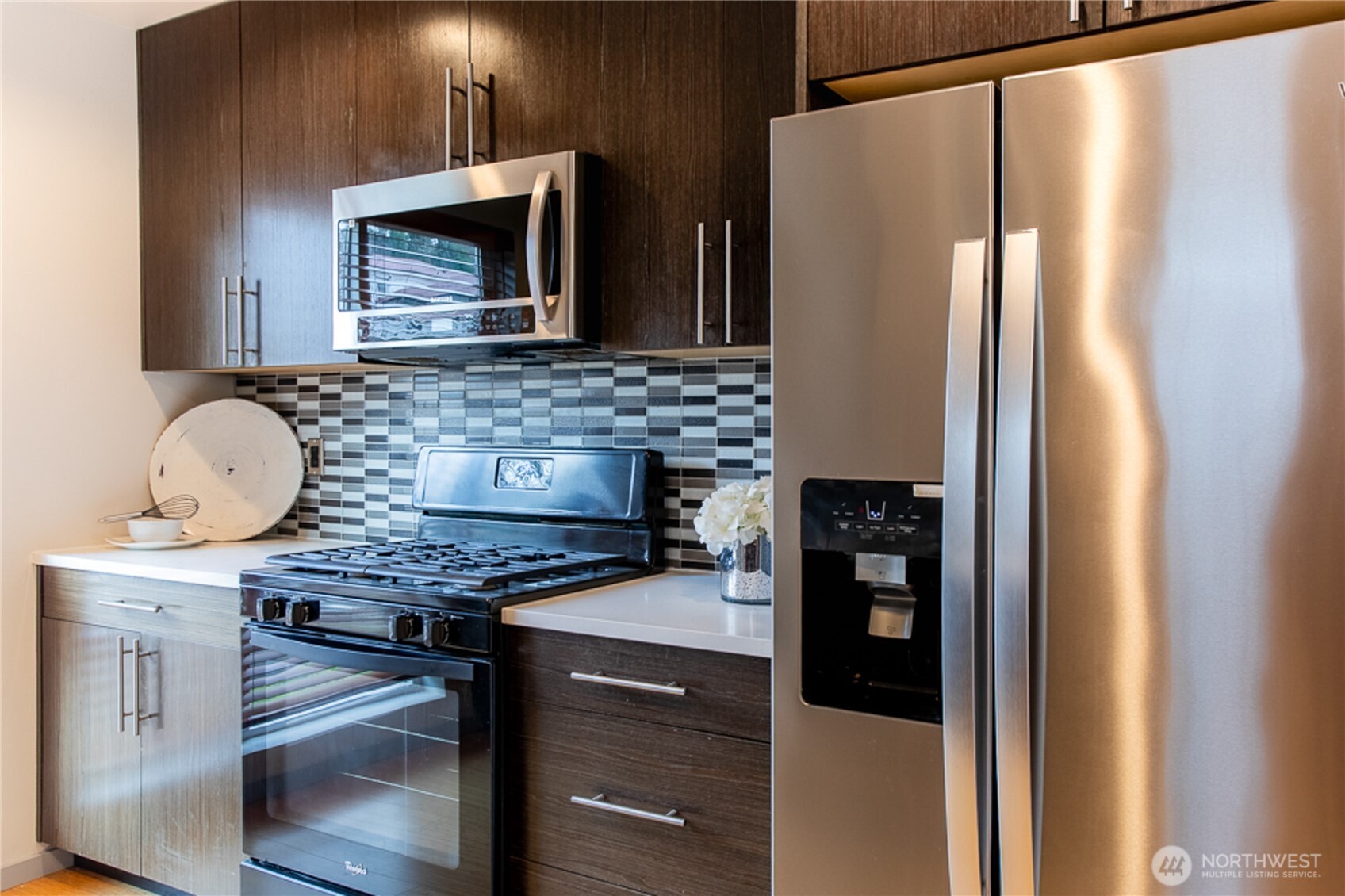 1465 South Columbian Way Seattle, WA 98144 - Photo 22 of 35 a kitchen with stainless steel appliances granite countertop a refrigerator and a stove top oven