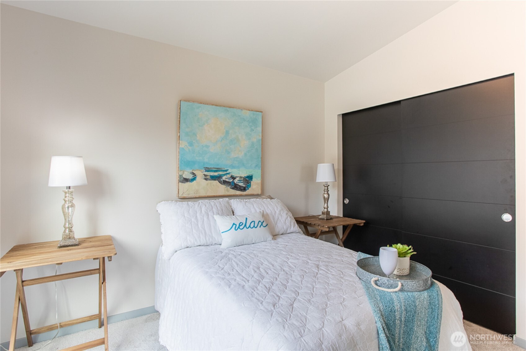 1465 South Columbian Way Seattle, WA 98144 - Photo 28 of 35 a bedroom with a bed and a lamp on table