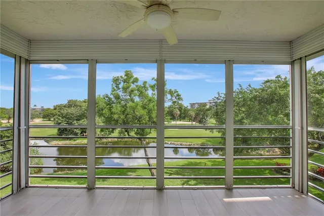 a view of a green room with a large window
