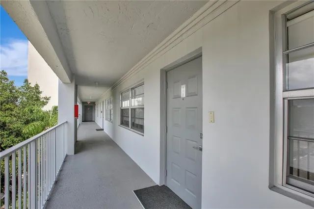 a view of a house with porch and wooden floor
