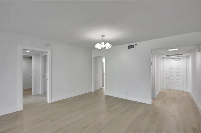 a view of an empty room with a bathroom