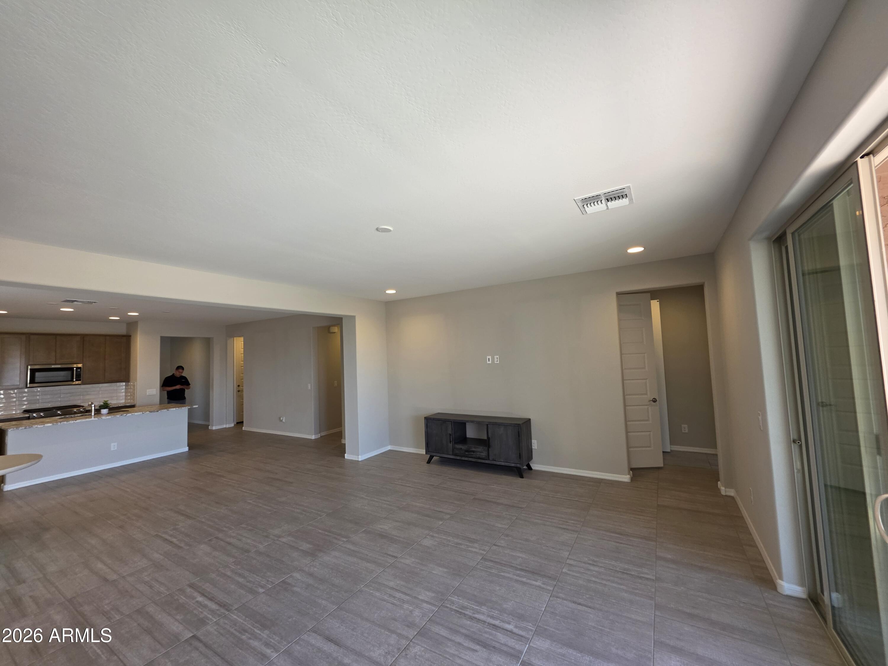 7128 West Coles Road Laveen, AZ 85339 - Photo 10 of 38 a view of a kitchen with a sink and a refrigerator