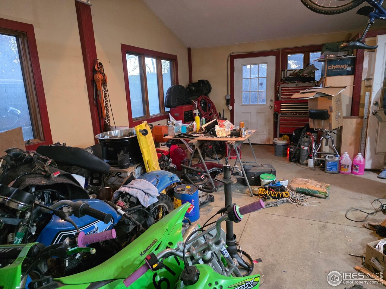 4355 Parfet Street Wheat Ridge, CO 80033 - Photo 11 of 40 a living room with lots of furniture and a gym