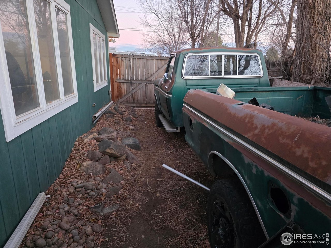 4355 Parfet Street Wheat Ridge, CO 80033 - Photo 14 of 40 a front view of a house with garden