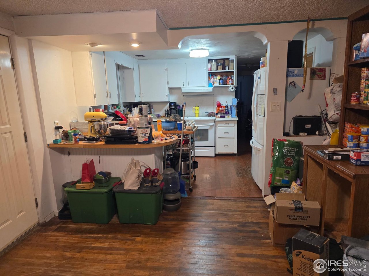 4355 Parfet Street Wheat Ridge, CO 80033 - Photo 24 of 40 a room with lots of wooden furniture and a view of living room