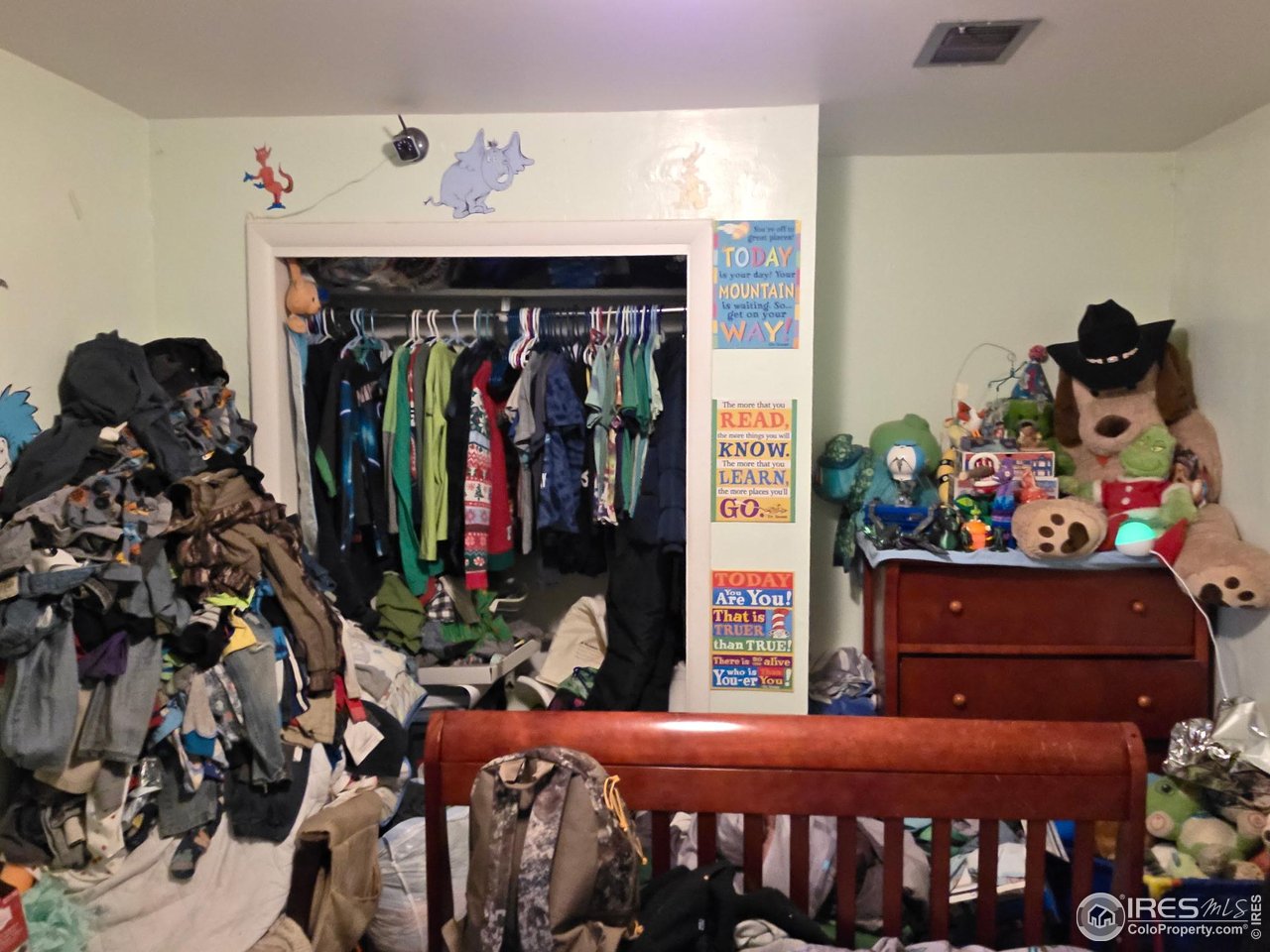 4355 Parfet Street Wheat Ridge, CO 80033 - Photo 29 of 40 a bedroom with a bed and closet