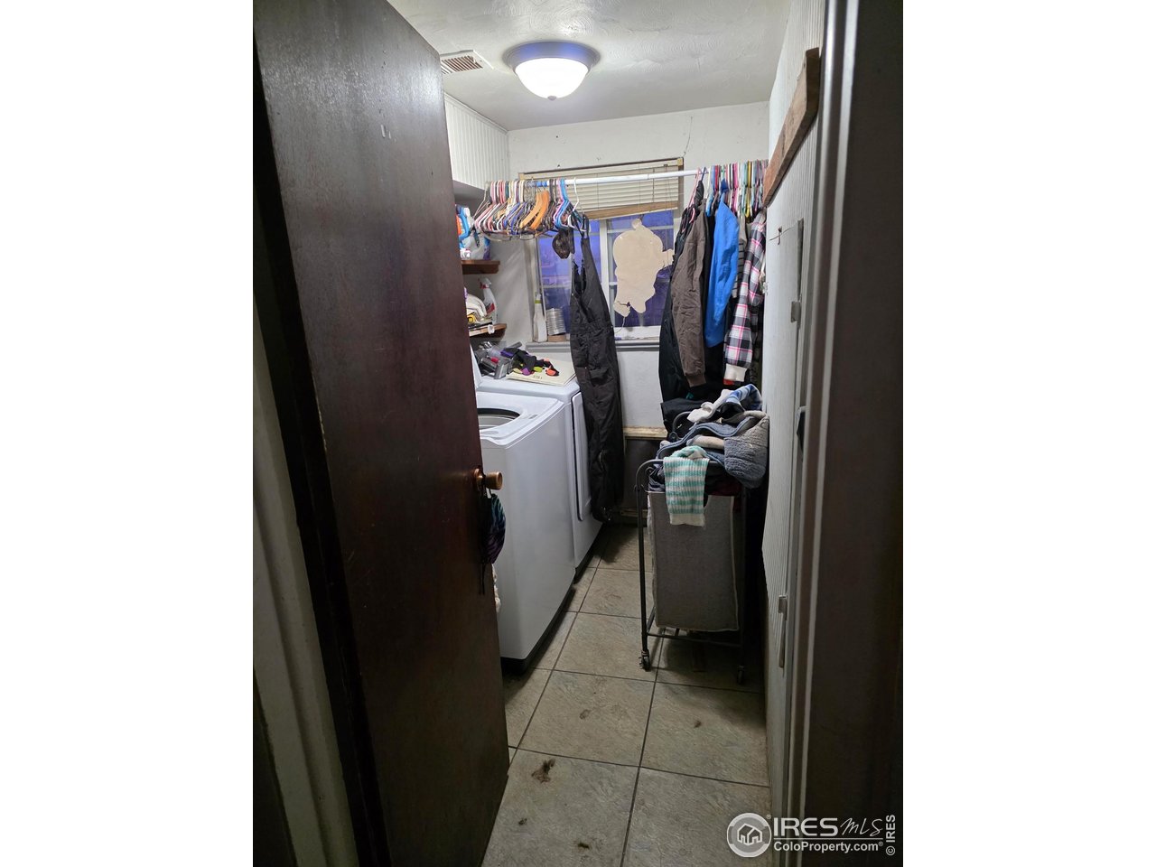 4355 Parfet Street Wheat Ridge, CO 80033 - Photo 31 of 40 a view of walk in closet with clothes