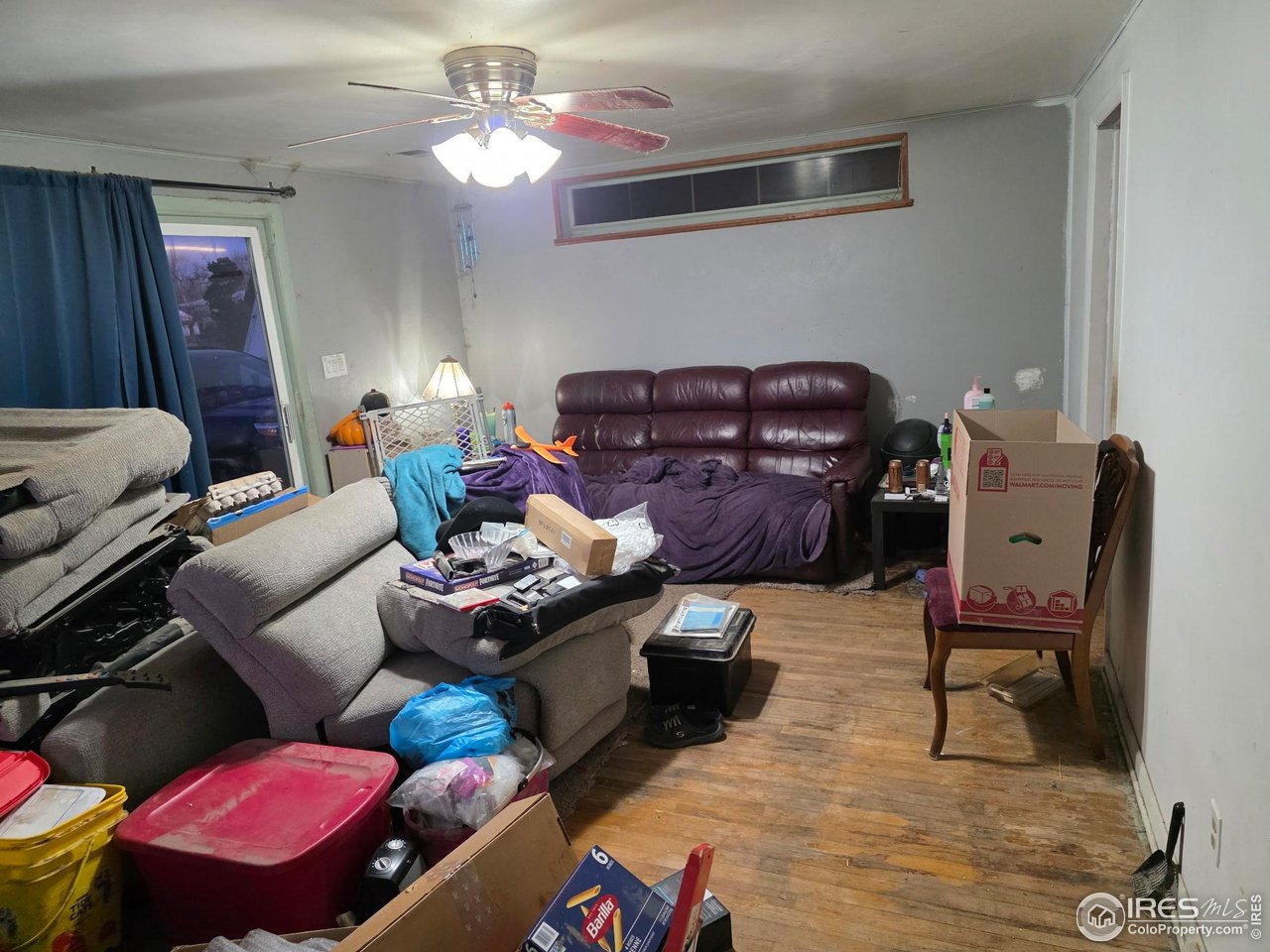 4355 Parfet Street Wheat Ridge, CO 80033 - Photo 35 of 40 a living room with furniture and wooden floor
