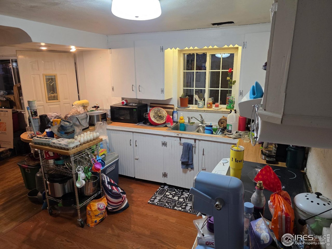 4355 Parfet Street Wheat Ridge, CO 80033 - Photo 39 of 40 a room with furniture a rug toys and a window