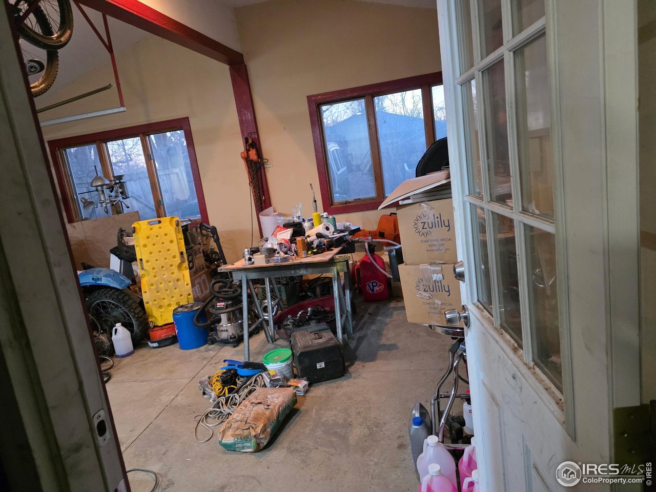 4355 Parfet Street Wheat Ridge, CO 80033 - Photo 10 of 40 a storage room with furniture and a window