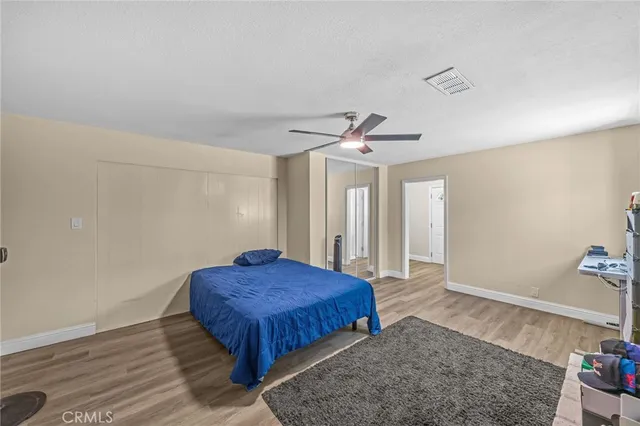 a bedroom with a bed and a dresser