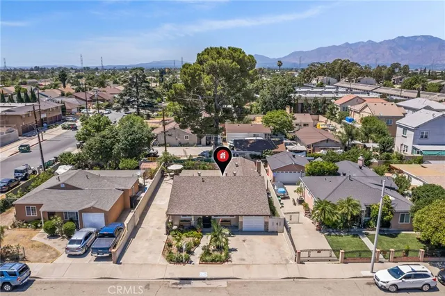 an aerial view of residential houses and outdoor space