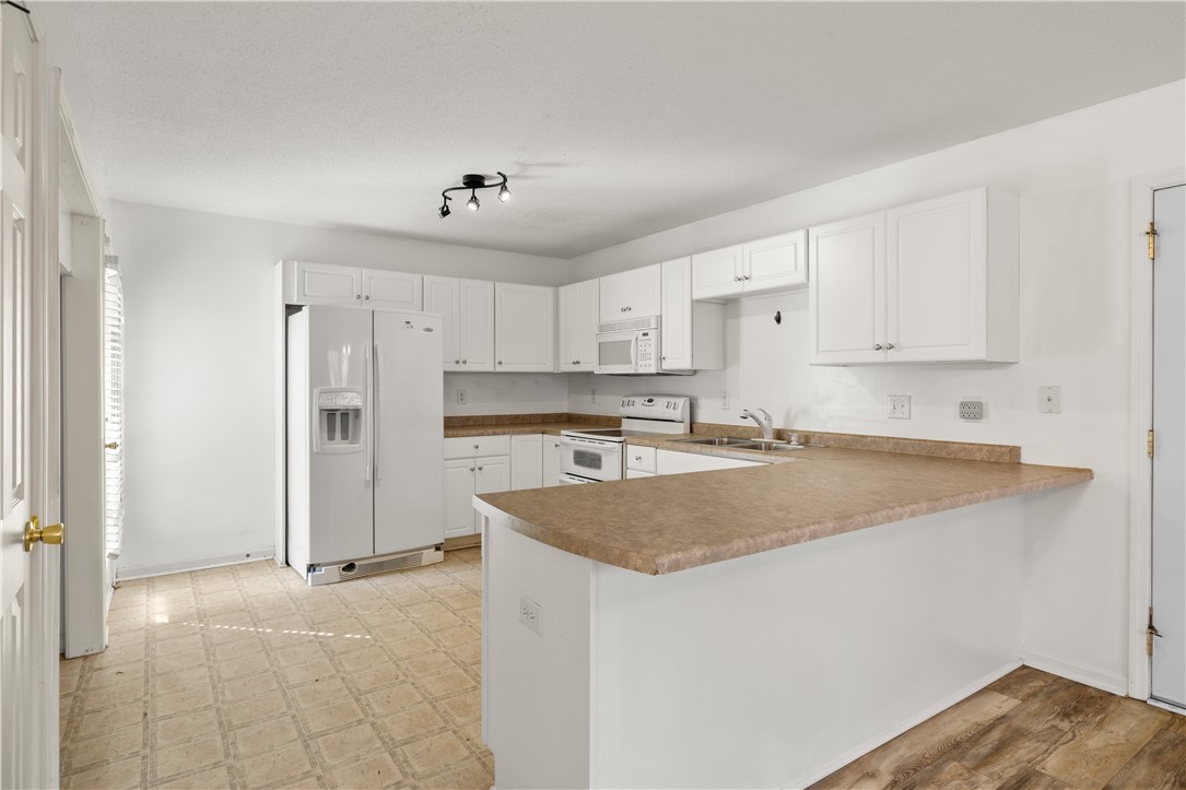 101 Buteos Way Anderson, SC 29621 - Photo 12 of 44 Bright and functional, this kitchen offers ample counter space and storage for culinary enthusiasts.