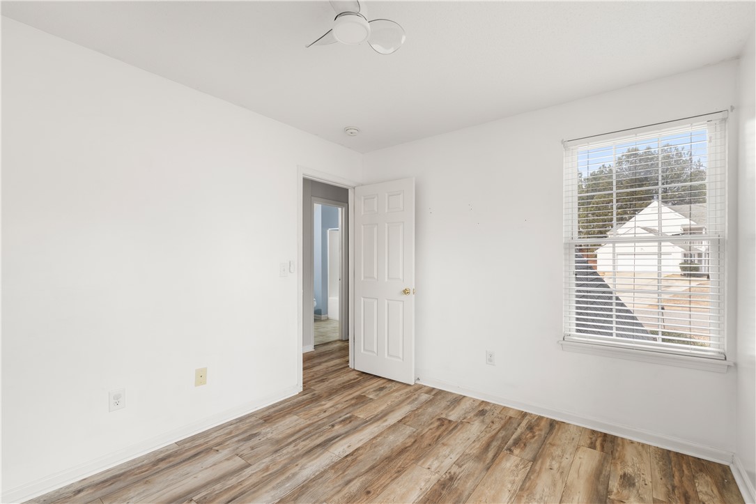 101 Buteos Way Anderson, SC 29621 - Photo 28 of 44 This spacious bedroom offers ample natural light and durable flooring, perfect for comfortable living.