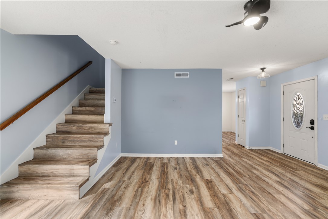 101 Buteos Way Anderson, SC 29621 - Photo 7 of 44 This inviting space features durable flooring, an elegant front door, and a staircase, ready for personal touches.