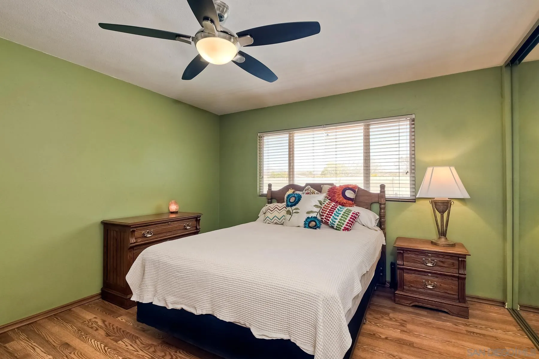 12861 Carriage Road Poway, CA 92064 - Photo 27 of 44 a bedroom with a bed and a chandelier