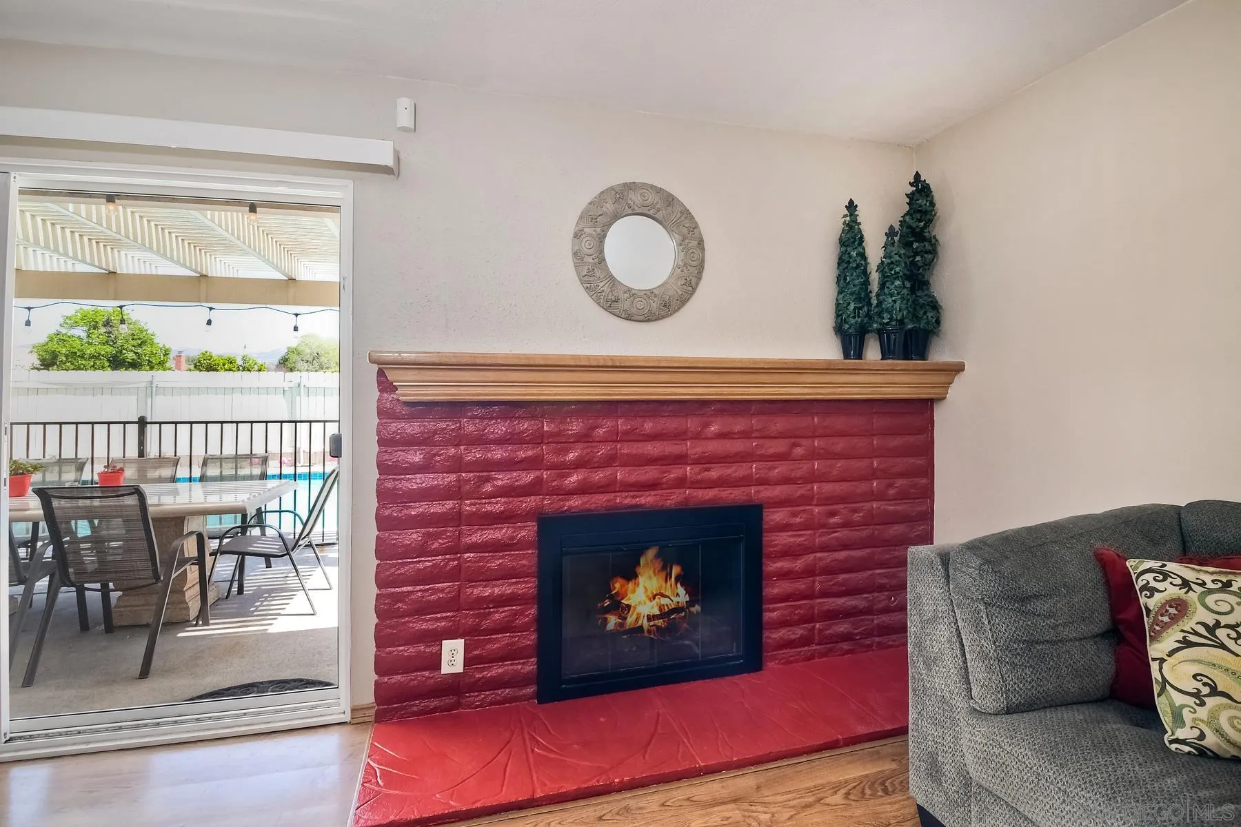 12861 Carriage Road Poway, CA 92064 - Photo 8 of 44 a living room with furniture a rug and a fireplace