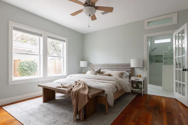 a bedroom with a bed and a window