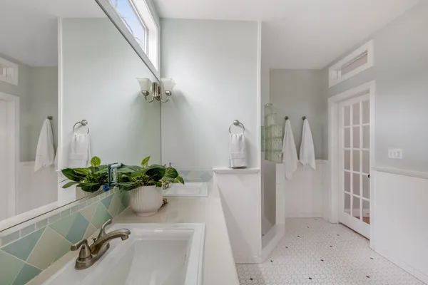a view of a hallway with a flower pot