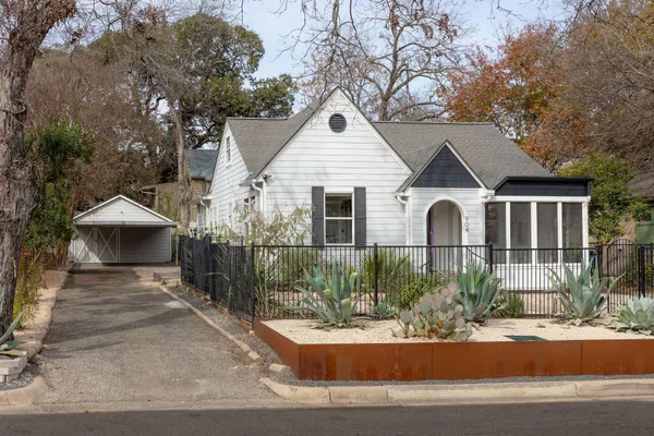 a front view of a house with garage