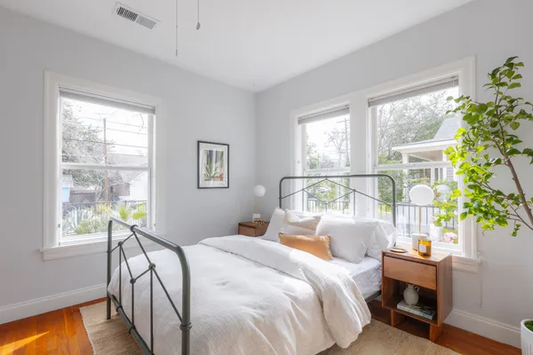 a bedroom with a bed and a table