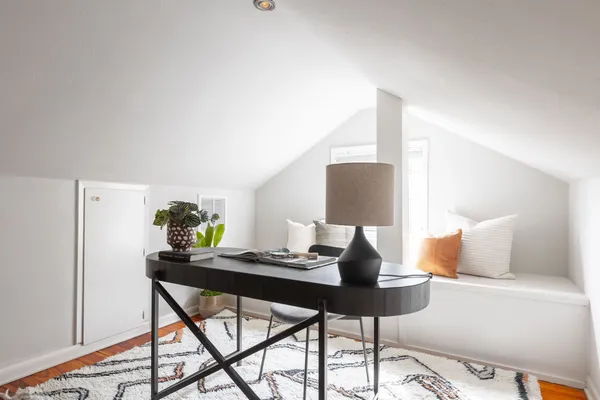 a workspace with furniture and lamp