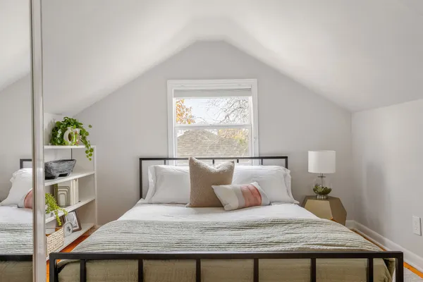 a bedroom with a bed and a table in it