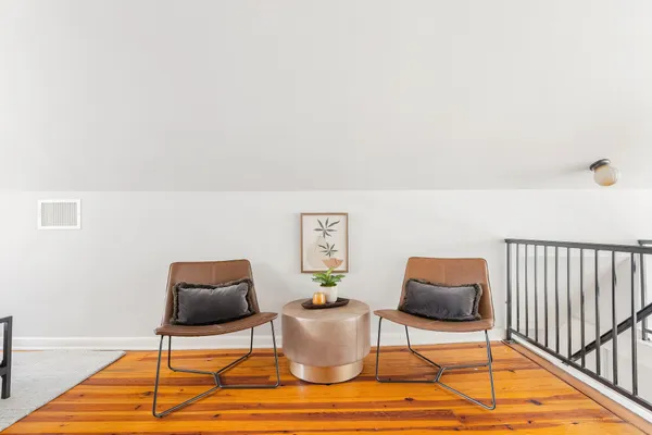 a living room with furniture and a rug