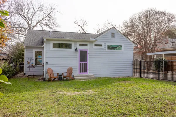 a front view of house with yard and seating area
