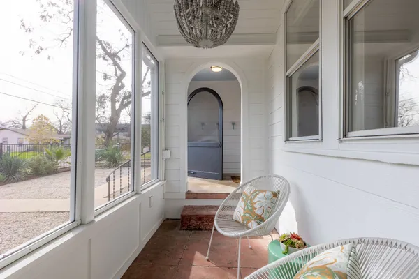 a front view of a house with large windows