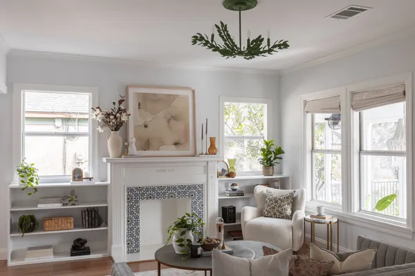 a living room with furniture and a fireplace