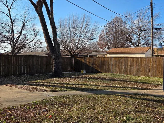 a view of a backyard of the house