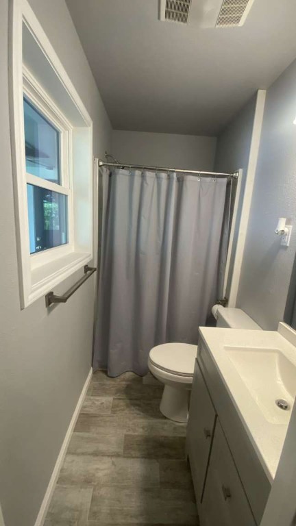 1202 Nix Road Lampasas, TX 76550 - Photo 20 of 20 Bathroom with vanity, dark wood-style floors, and curtained shower