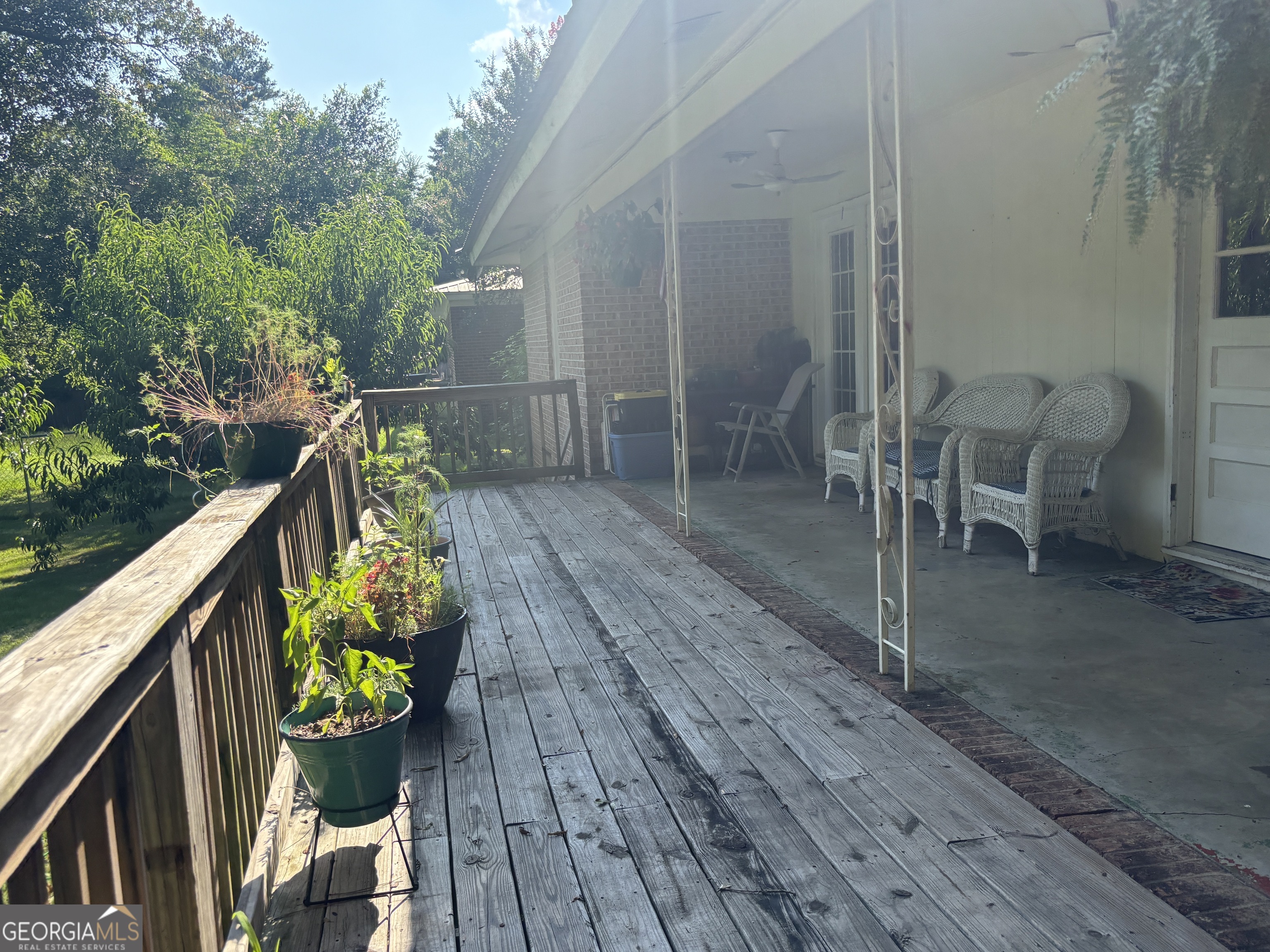 152 Crest Drive Cochran, GA 31014 - Photo 51 of 54 a balcony with wooden floor and outdoor seating