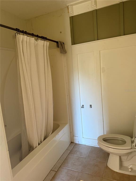 8330 Northeast 100th Avenue Bronson, FL 32621 - Photo 11 of 17 a bathroom with a shower and a toilet