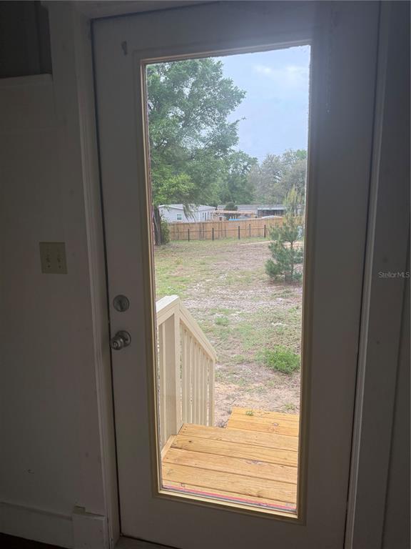8330 Northeast 100th Avenue Bronson, FL 32621 - Photo 12 of 17 a view of a glass door with a from a window